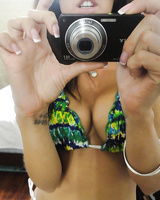 Hot babe Capri Cavanni takes self shots exposing big tits and body in bikini