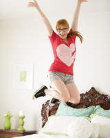 Cute ginger with glasses Penny Pax stripping down naked in the bedroom