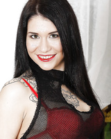 Tattooed brunette taking off her provocative outfit and toying her wet cunt