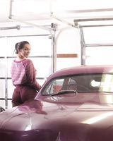 Cute MILF Holly Michaels gets naked for nude posing inside vintage automobile