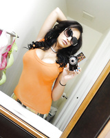 Brunette sex doll Jamie Valentine takes some self shots of big tits and ass