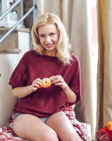 Sexy blond chick Mary Lin takes off her sweater on her way to pussy fingering