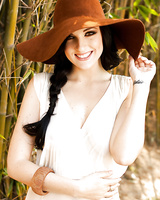 Sweet brunette babe with big melons Kaya Danielle stripping outdoor