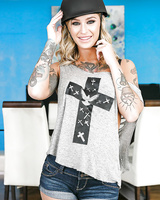 Tattooed blonde Kleio Valentien removing riding cap and clothes to pose naked