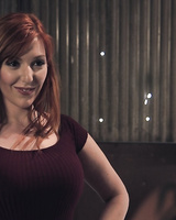 Busty redhead Lauren Phillips is gagged and tied up with rope for a hard fuck