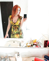 Amateur redhead girl Rainia Belle makes sexy, amusing self shots
