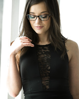Babe in glasses Maya Bijou takes off her black lingerie exposing perky tits