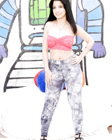 Fully clothed MILF Nadia Ali undressing thong to air her round ass outdoors