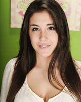 Amateur brunette Natalie Monroe gets undressed for that naked feeling