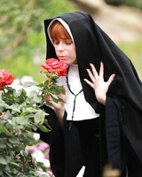 Redheaded nun Penny Pax shows off her big natural boobs and and twat