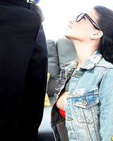 Raven Bay gets on her knees for oral sex wearing a denim jacket and glasses