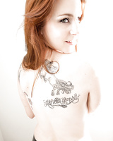 Hot redhead in latex, stockings & boots spreading ass and flaunting hot pussy