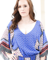 MILF with a nice figure Savannah Fyre undresses for an erotic strip show