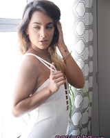 Solo model Uma Jolie removes her white dress for nude posing