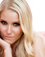 Sexy blonde chick Vanessa Cage crosses her legs in pink heels once she's naked