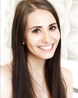 MILF with big eyes and pretty face fondling her naked boobs and pussy