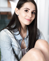 Hot dark haired woman spreading nude and masturbating her oiled bald pussy