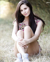 Erotic teen model disrobing outdoors to spread her beaver in the fresh air