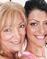 Horny granny with saggy tits and a young teen girl go lesbian on a couch