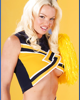Busty cheerleader Rhylee Richards demonstrates comely boobs and booty