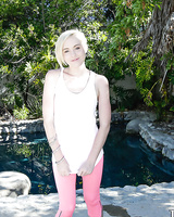 Pornstar Miley May takes off her leggings and plays with shaved snatch