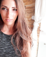 French beauty takes selfies while stripping down to sheer lingerie