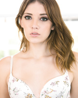 Pretty brunette Lena Anderson removes bra & thong to display her hot ass