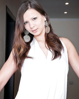 Busty babe in nylon stockings Bianka stripping and spreading her legs