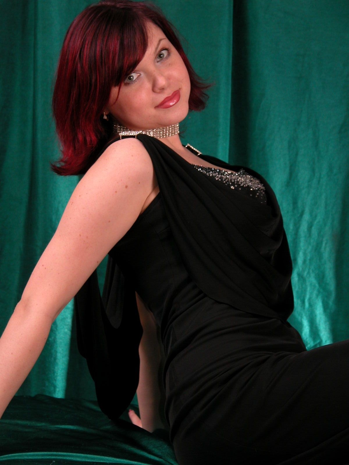 Busty redhead babe in black dress