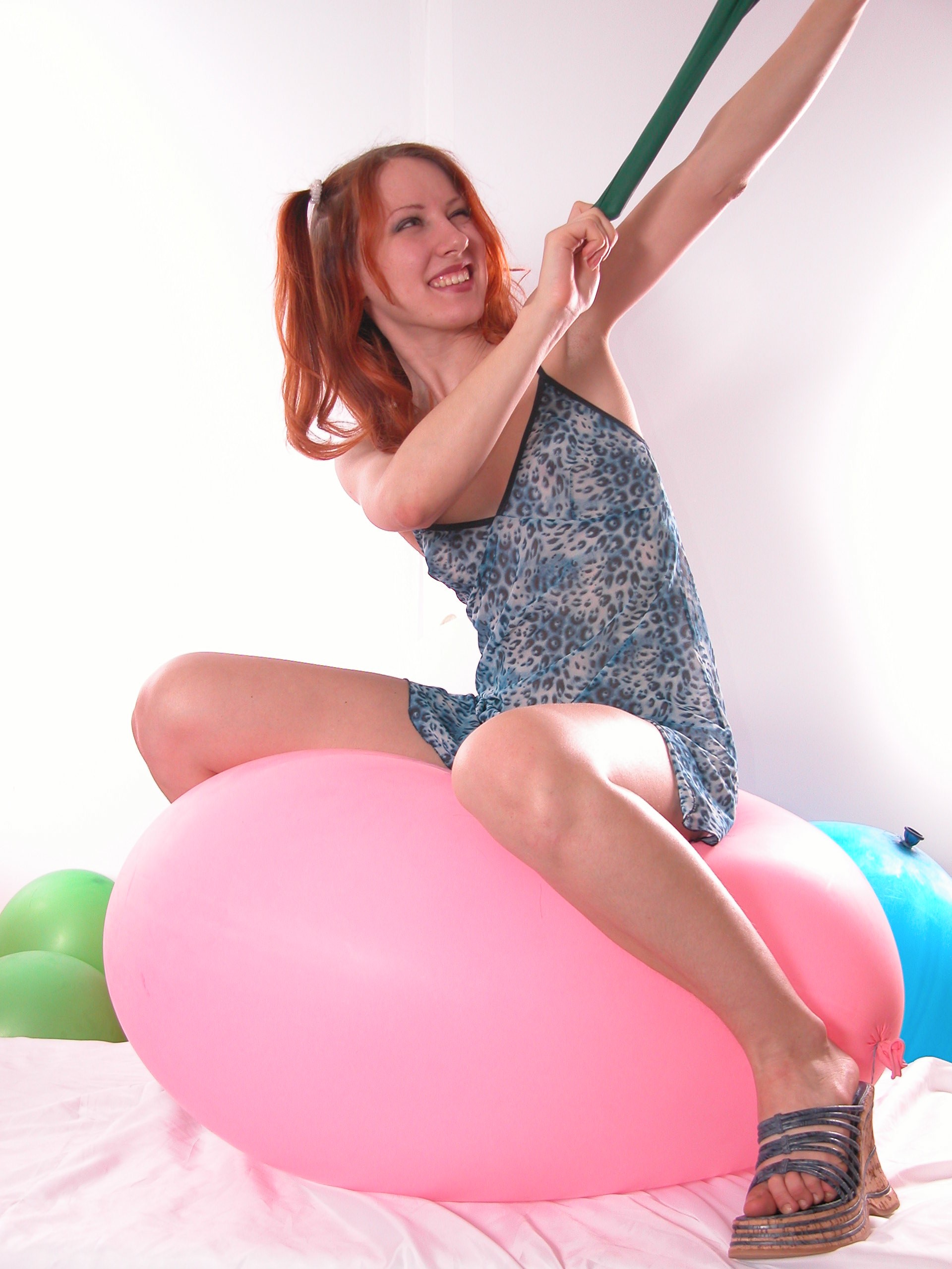 Redhead chick has fun with balls