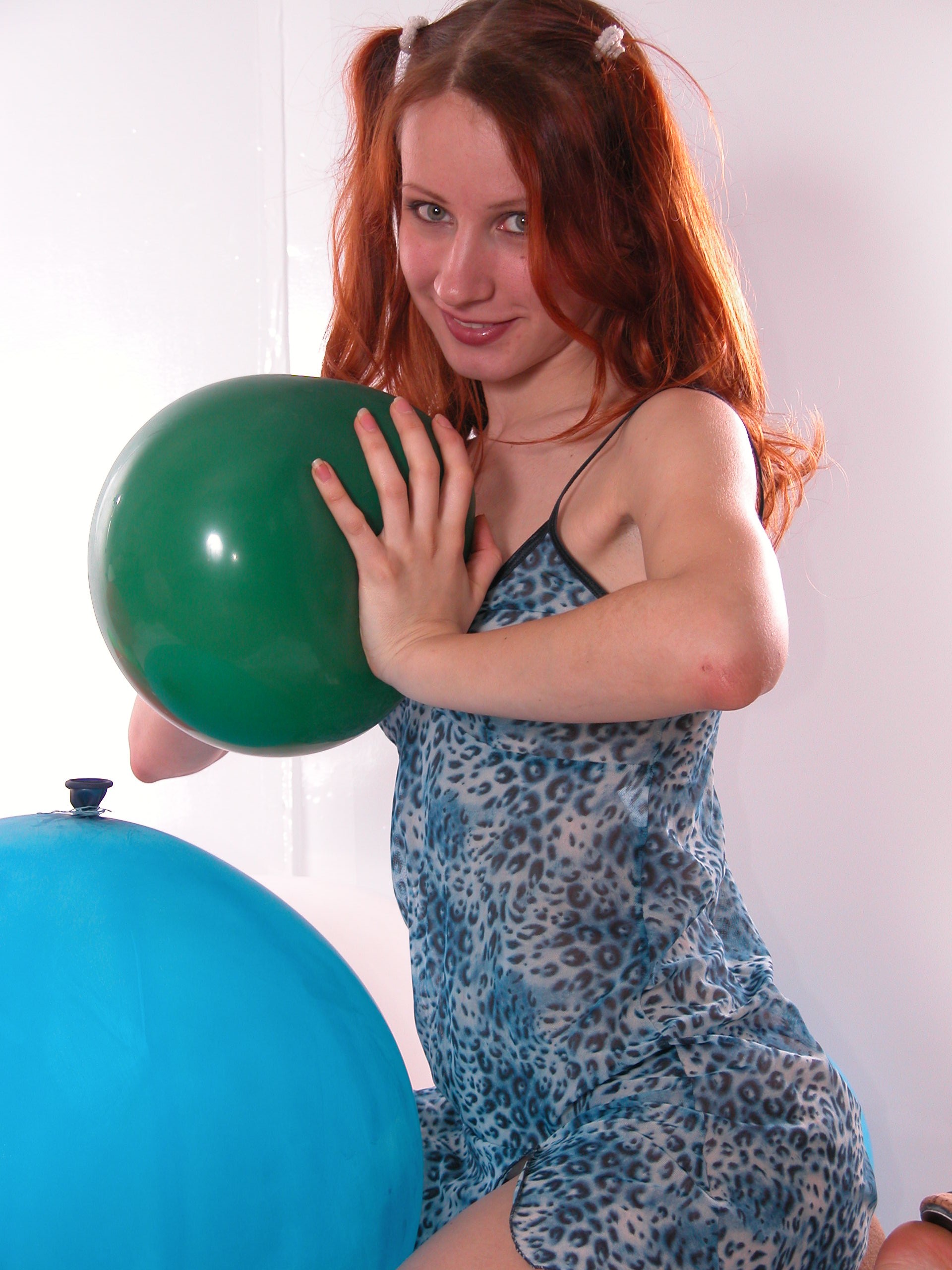 Redhead chick has fun with balls