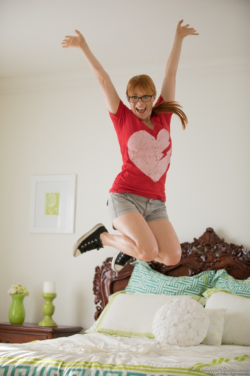 Cute ginger with glasses Penny Pax stripping down naked in the bedroom