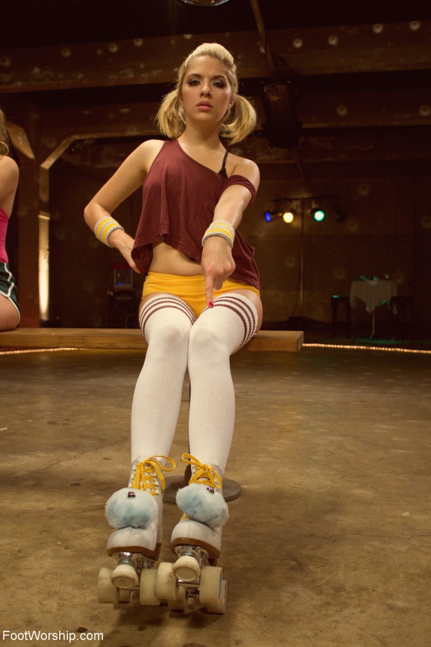 White girls in roller skates and striped socks expose their small tits