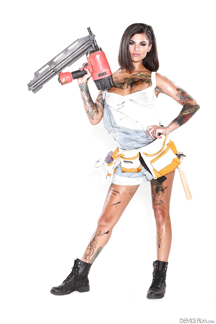 A group of tattooed females let their tits escape from skimpy work shirts