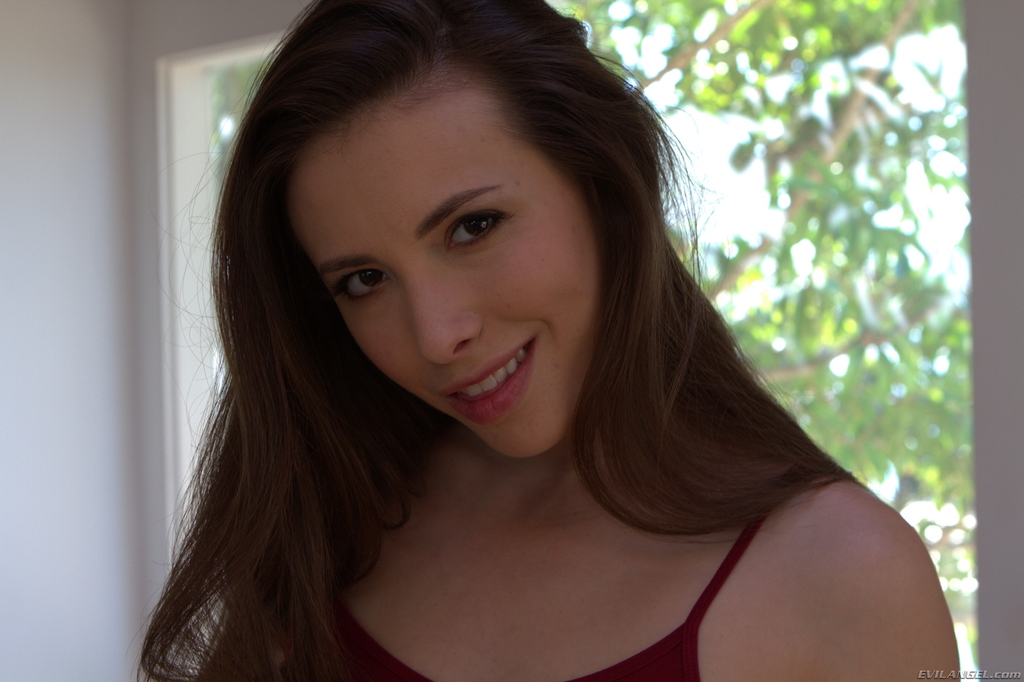 Solo girl Casey Calvert shows off her sexy ass in and out of red panties