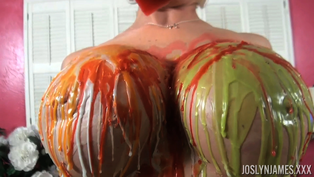 Naked female Joslyn James pours liquid wax all over her nice melons