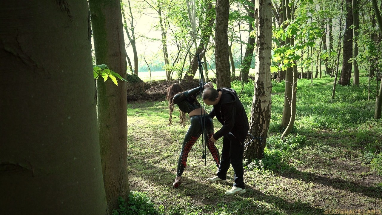 Belgian female Julie Skyhigh is taken into woods for BDSM training session