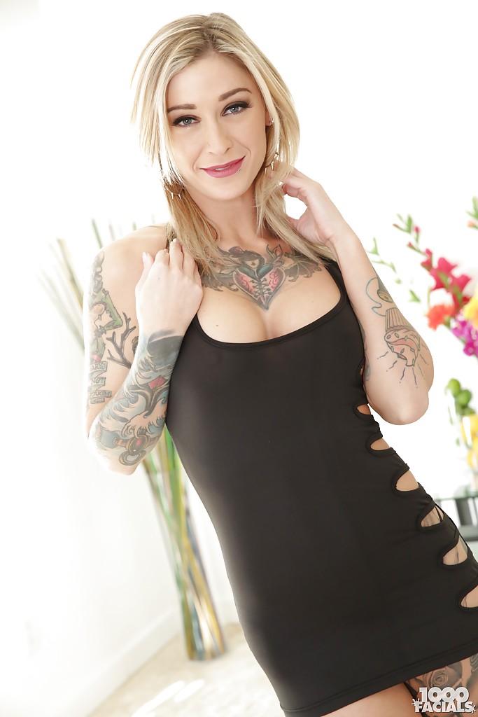 Inked blonde babe Kleio Valentien freeing big tits and ass from dress