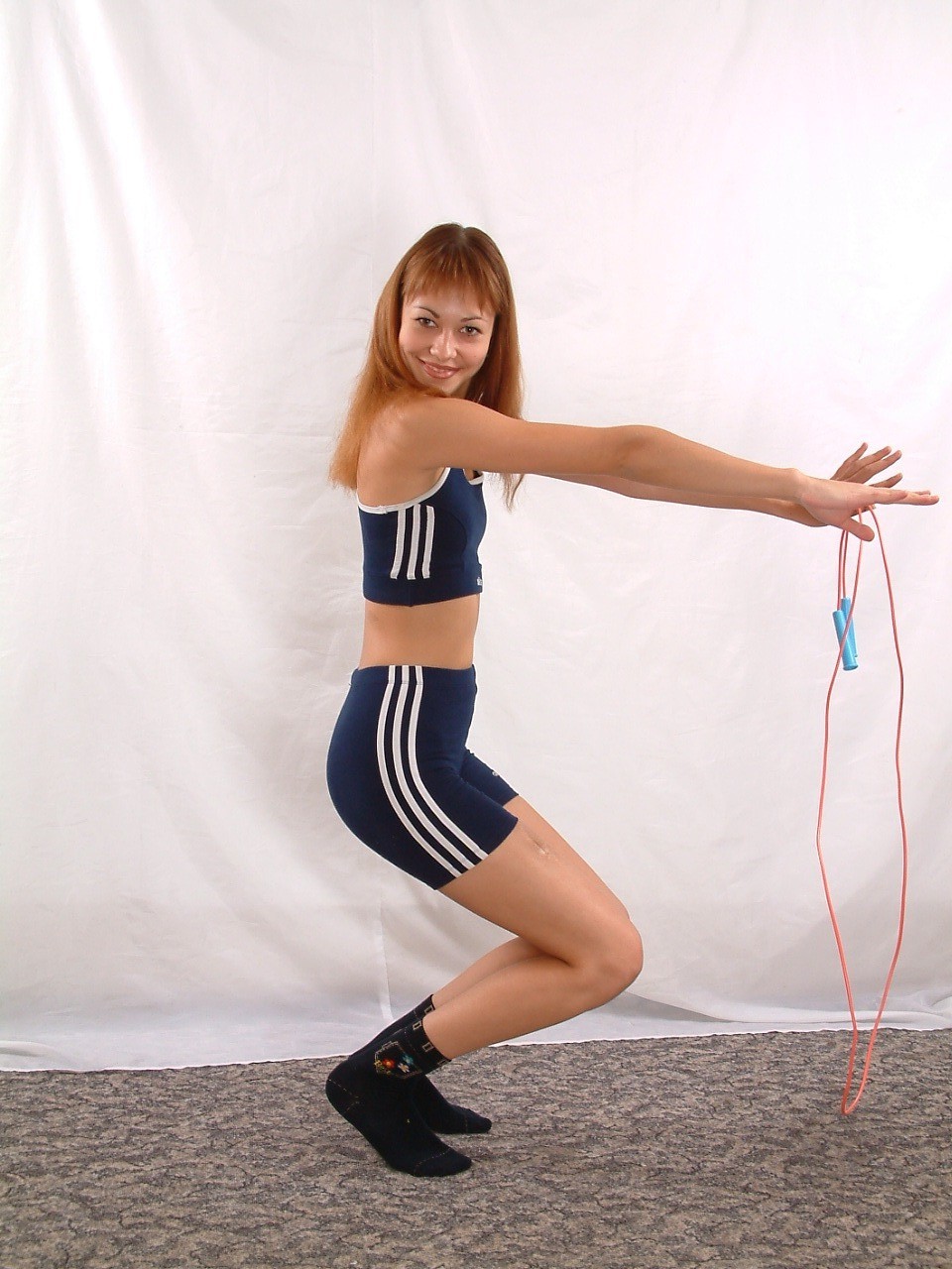 Sporty ginger babe with jumping-rope