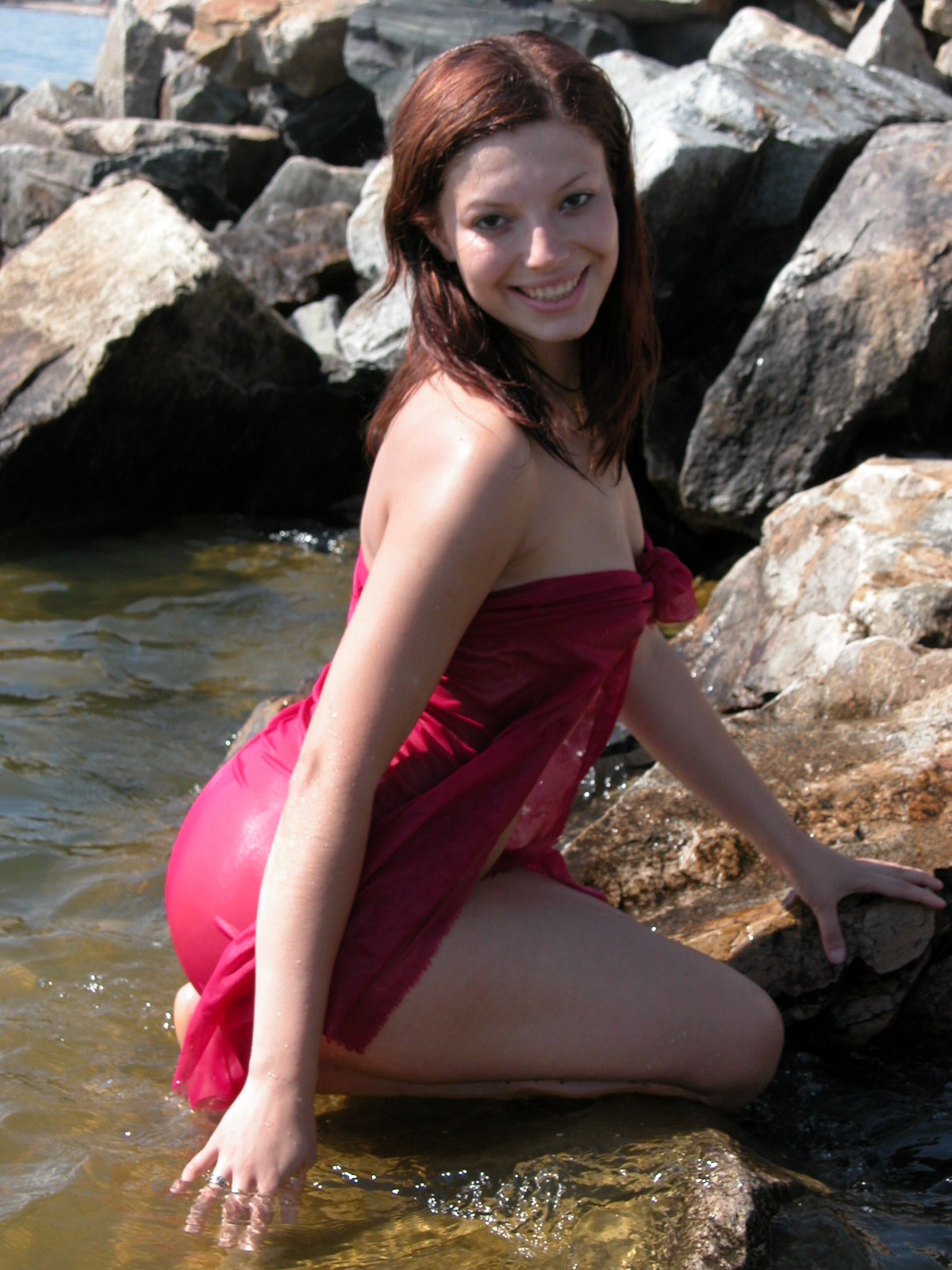 Awesome chick poses on the rocks
