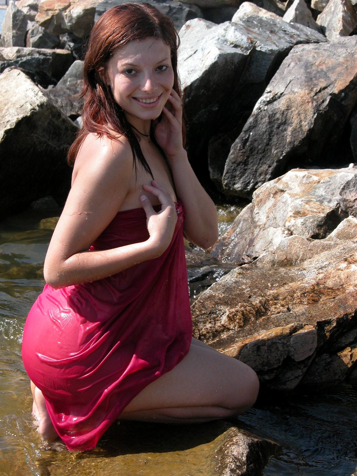 Awesome chick poses on the rocks