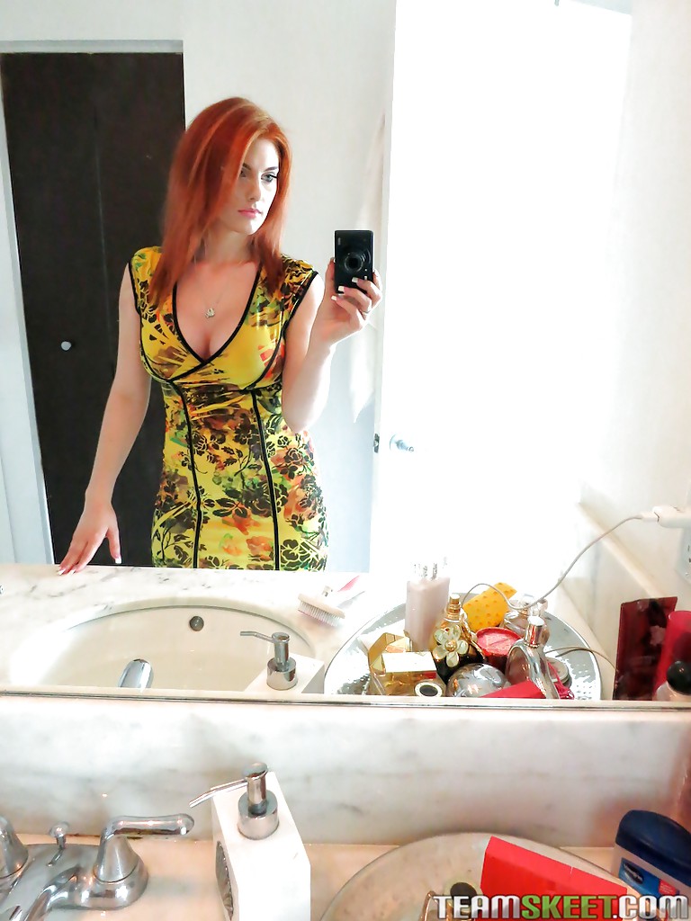 Amateur redhead girl Rainia Belle makes sexy, amusing self shots