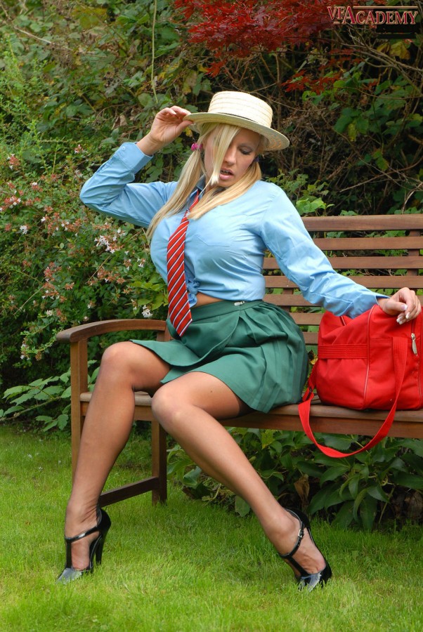 Busty blonde Michelle Thorne shows off her private parts on a garden bench