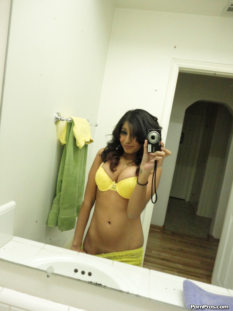 Brunette girlfriend type Ruby Reyes takes self shots on exposed boob in mirror