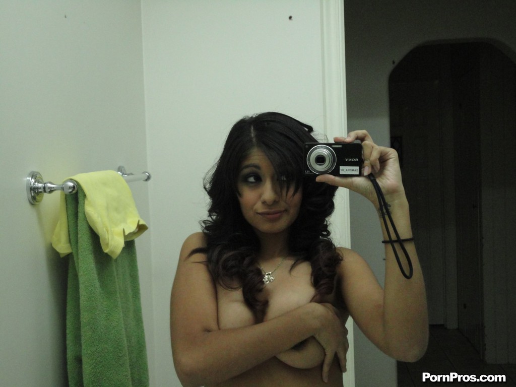 Brunette girlfriend type Ruby Reyes takes self shots on exposed boob in mirror