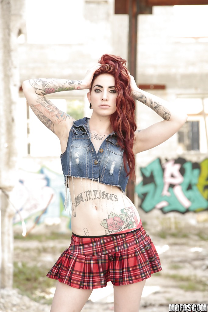Outdoor posing from an tattooed redhead with nice boobs Sheena Rose