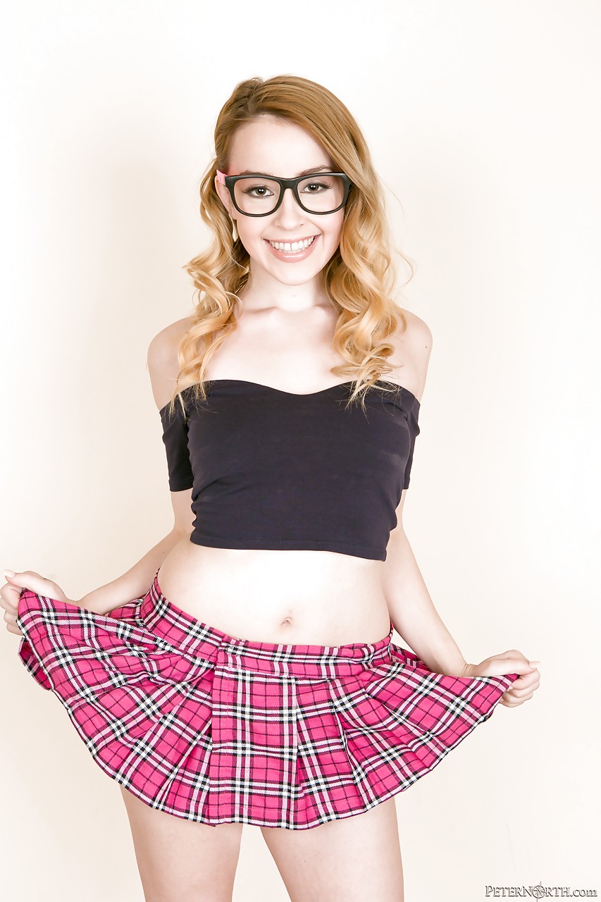 Schoolgirl Alexia Gold in glasses undressing to show small tits & bare ass