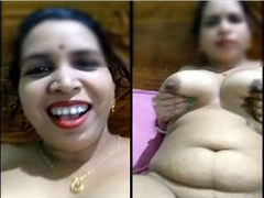 Attractive Desi woman with big boobs is smiling because she wants that XXX