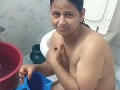 Shy Indian wife enjoys conversation while she washes her naked body in the bathroom