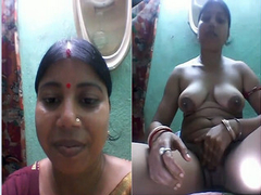 Chubby Desi with phenomenal boobs and a cute face recording XXX action